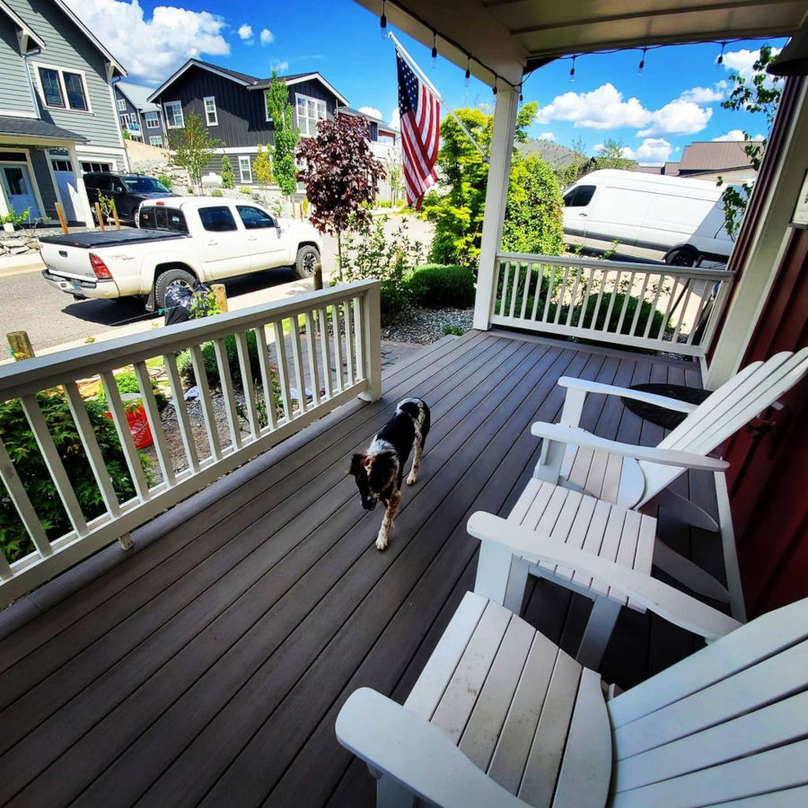 Porch deck with trex railing usa flag and dog