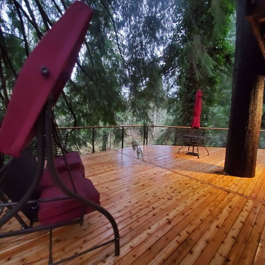 Tree fort cedar wood Seattle forest deck outdoor living space.