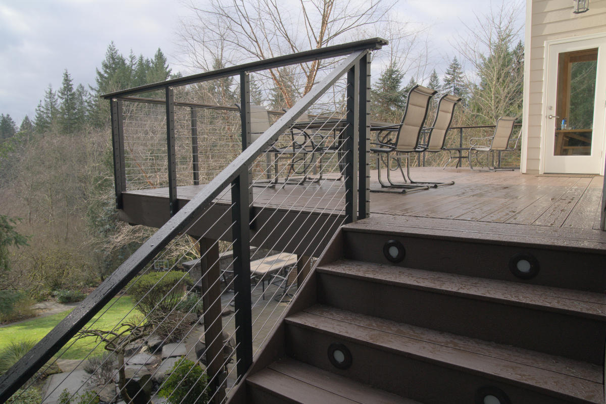 Redmond deck balcony build looking up stairs with cable railing in the woods