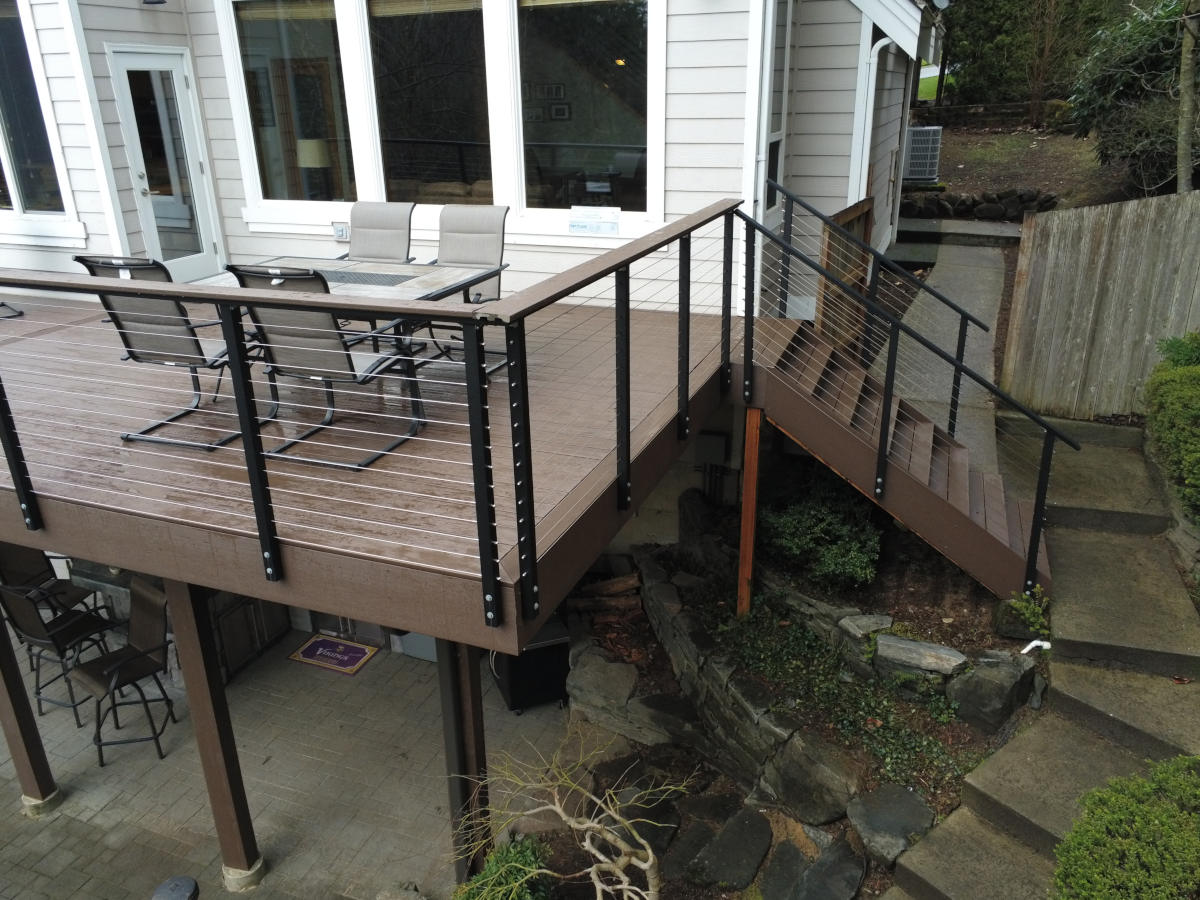 Redmond forest deck balcony with cable railing stairs to lower level