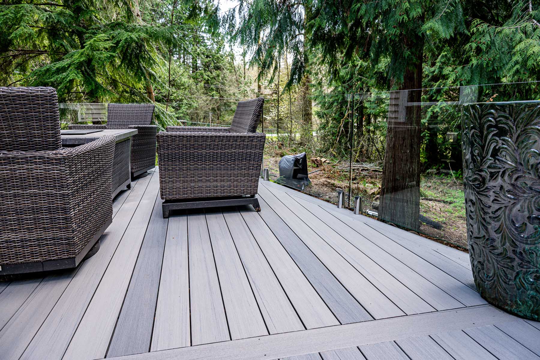 Gray Tone Deck With Glass Railing Installed And Furnished In Bellevue ...